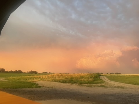 Evening sky over grassland and a country road